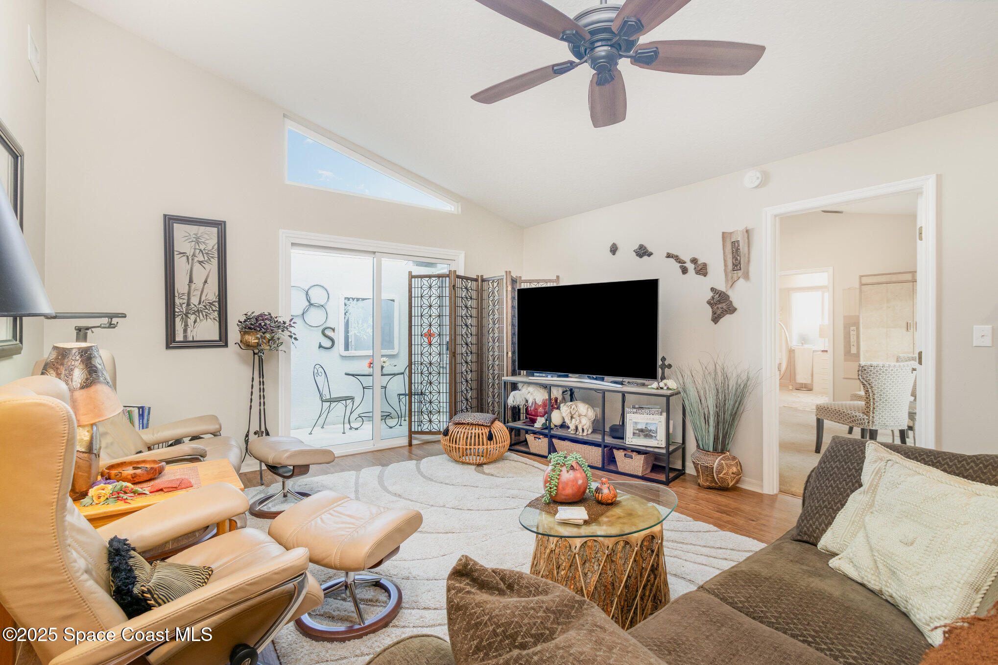 1484 Independence Avenue Melbourne, FL 32940 - Photo 3 of 30 a living room with furniture and a flat screen tv