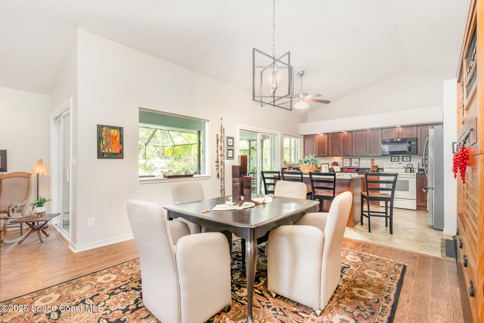 1484 Independence Avenue Melbourne, FL 32940 - Photo 5 of 30 a dining room with furniture a window and wooden floor