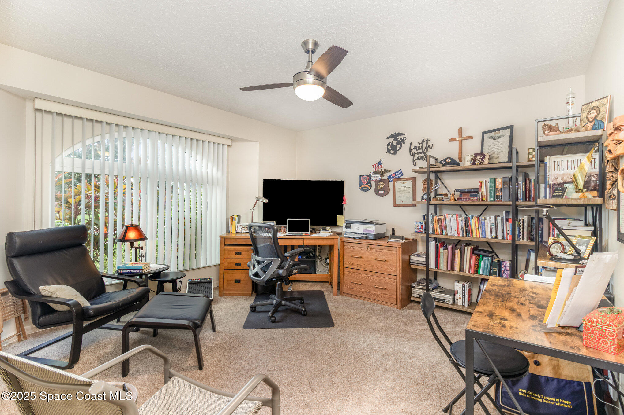 1484 Independence Avenue Melbourne, FL 32940 - Photo 8 of 30 a workspace with a flat screen tv and a window