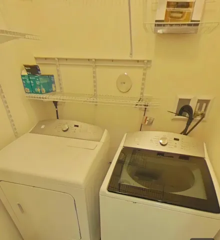 a utility room with dryer and washer