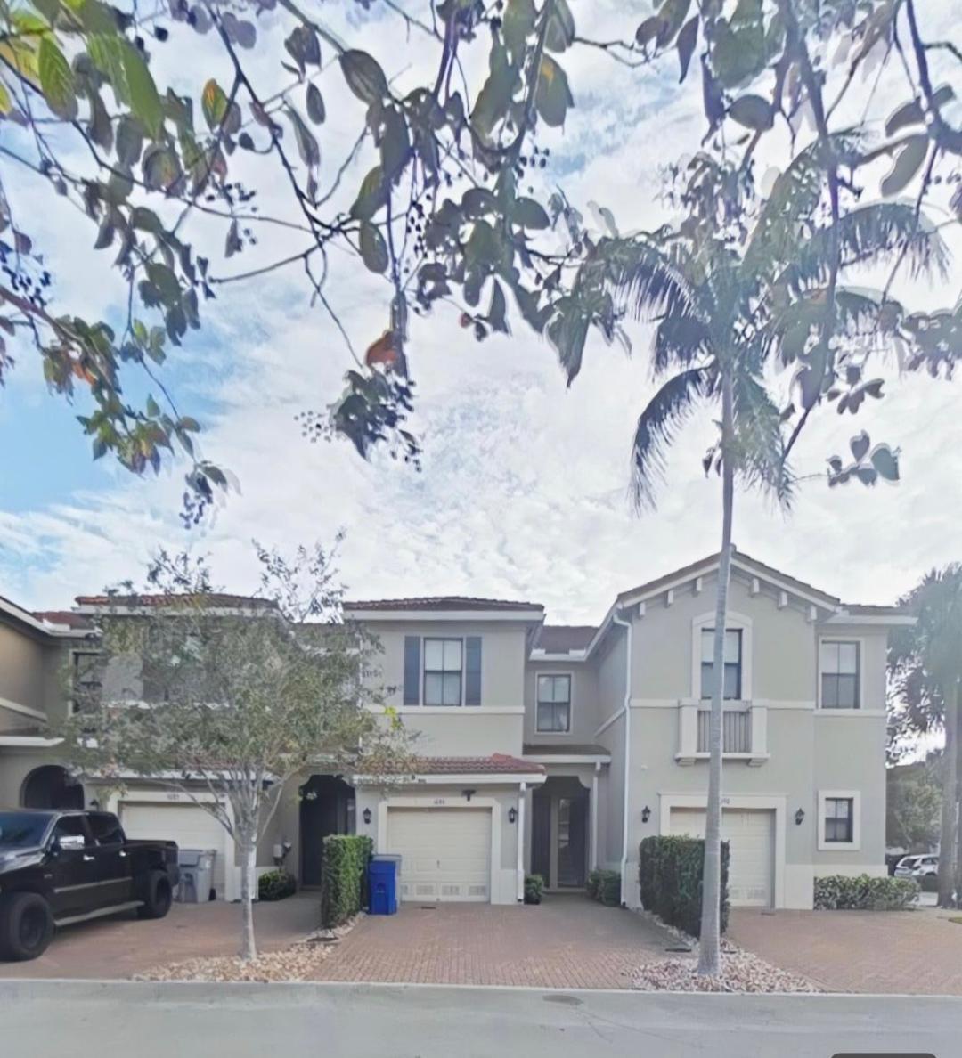 1087 Northwest 33rd Manor Pompano Beach, FL 33064 - Photo 9 of 12 a view of a street in front of a building