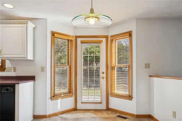 a kitchen with stainless steel appliances granite countertop a refrigerator stove top oven and sink