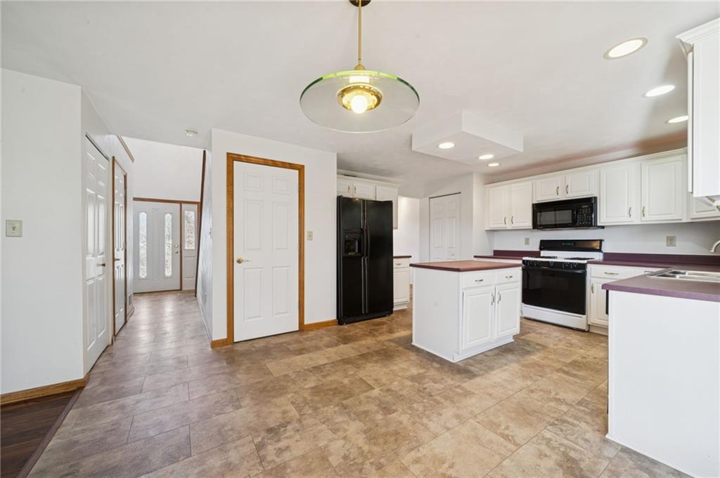 1051 Finchley Road Irwin, PA 15642 - Photo 16 of 36 a kitchen with a refrigerator and a stove top oven