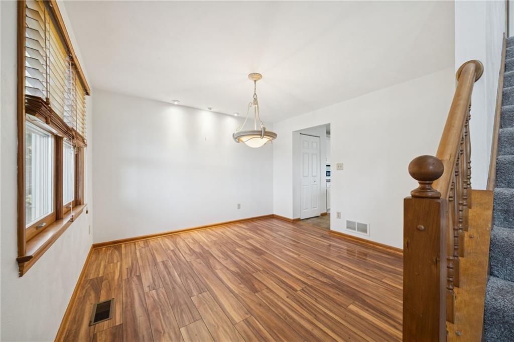 1051 Finchley Road Irwin, PA 15642 - Photo 19 of 36 a view of empty room with wooden floor and windows