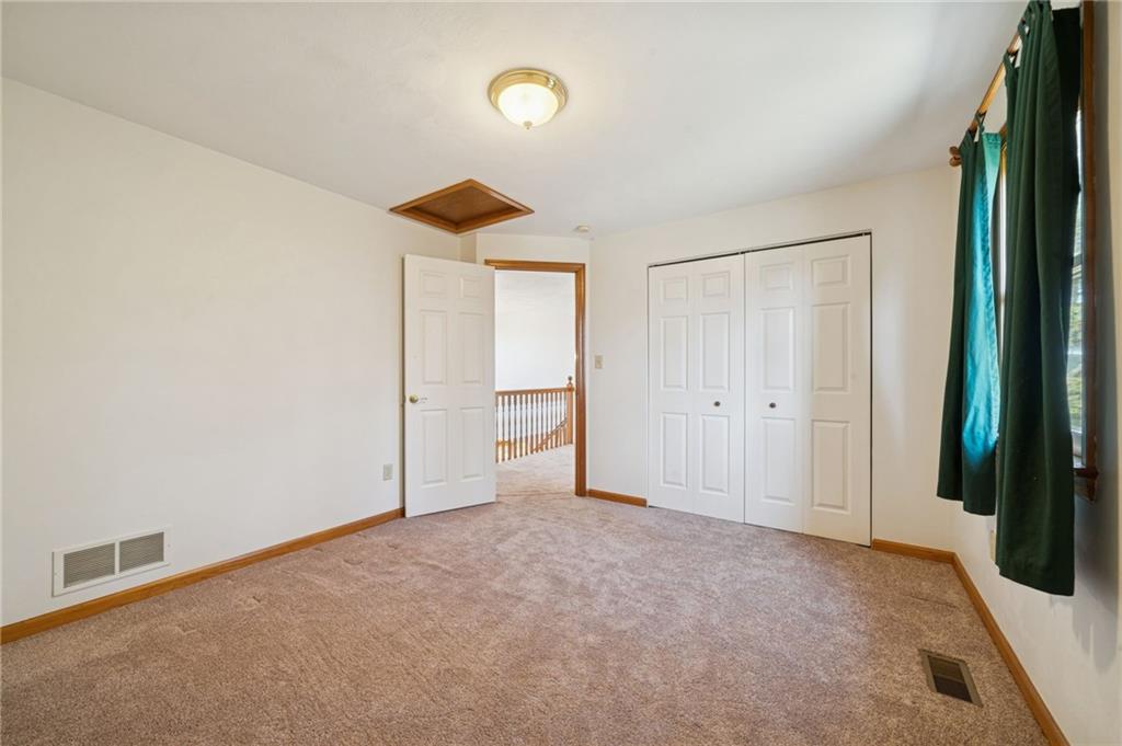 1051 Finchley Road Irwin, PA 15642 - Photo 28 of 36 an empty room with closet and windows
