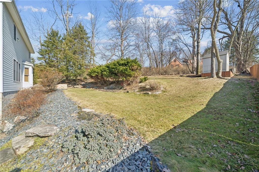 1051 Finchley Road Irwin, PA 15642 - Photo 30 of 36 a view of a yard with plants and trees