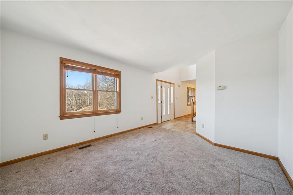 1051 Finchley Road Irwin, PA 15642 - Photo 3 of 36 an empty room with windows and closet