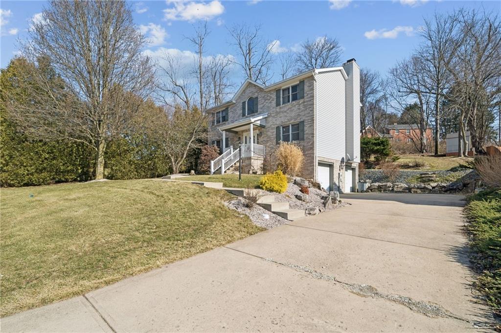 1051 Finchley Road Irwin, PA 15642 - Photo 32 of 36 a view of a house with snow on the road