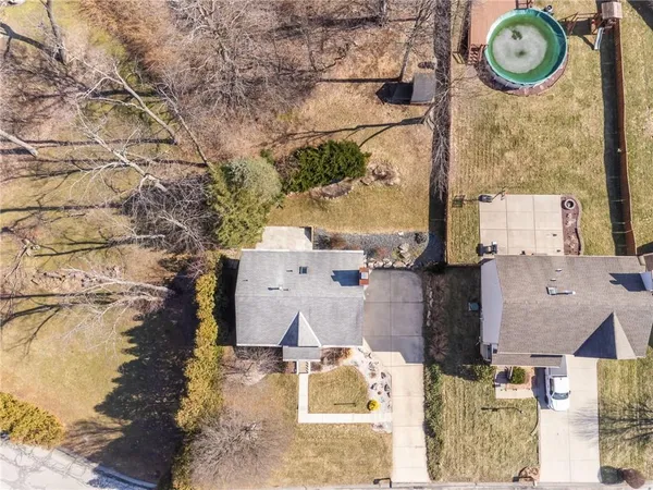 an aerial view of a house with a swimming pool