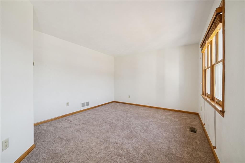 1051 Finchley Road Irwin, PA 15642 - Photo 5 of 36 an empty room with windows