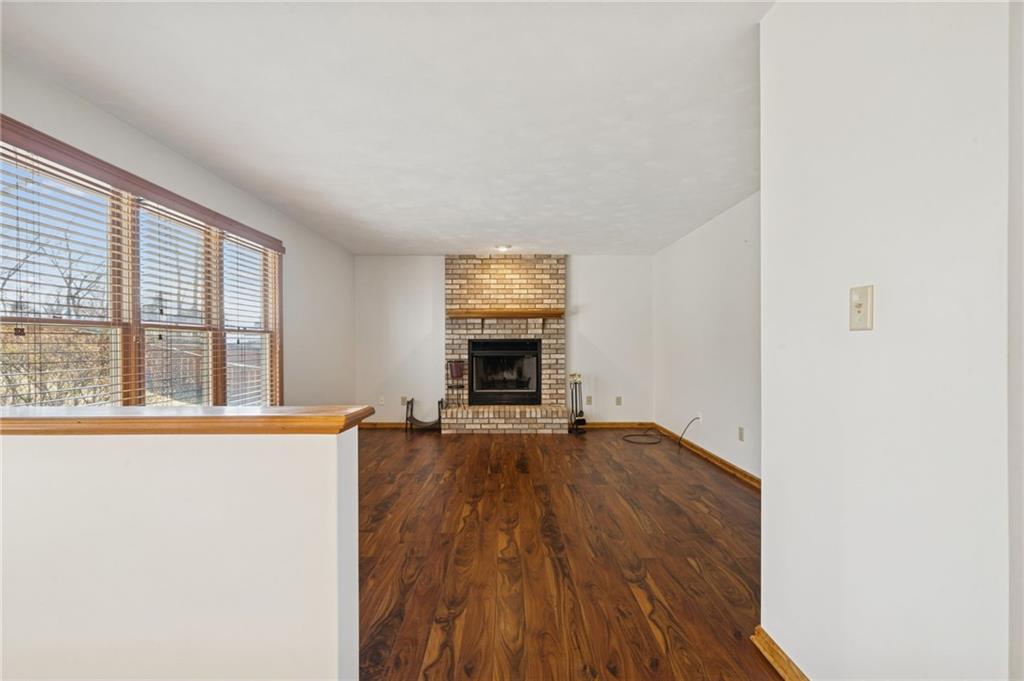 1051 Finchley Road Irwin, PA 15642 - Photo 7 of 36 wooden floor in an empty room with a window