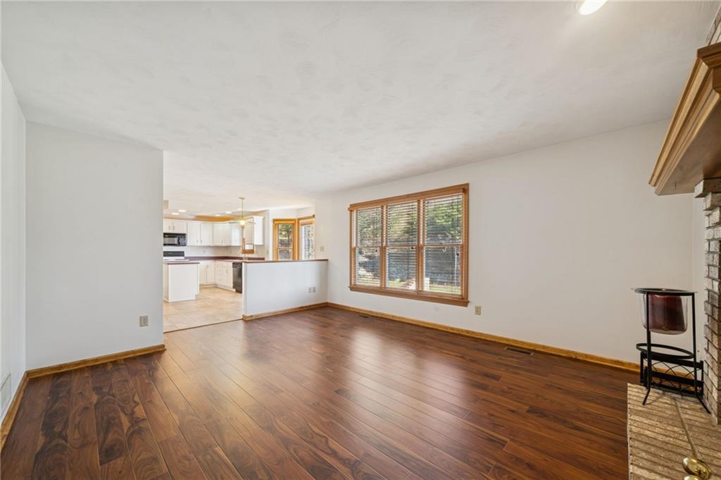 1051 Finchley Road Irwin, PA 15642 - Photo 8 of 36 a view of a kitchen with wooden floor and a window