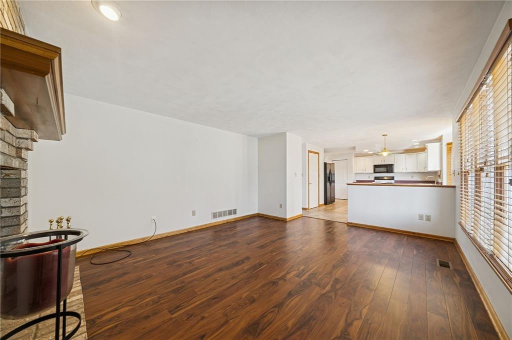 1051 Finchley Road Irwin, PA 15642 - Photo 9 of 36 a view of a kitchen with wooden floor and electronic appliances