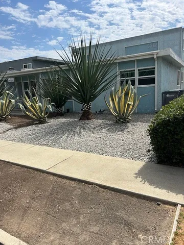 a view of a garage with a patio