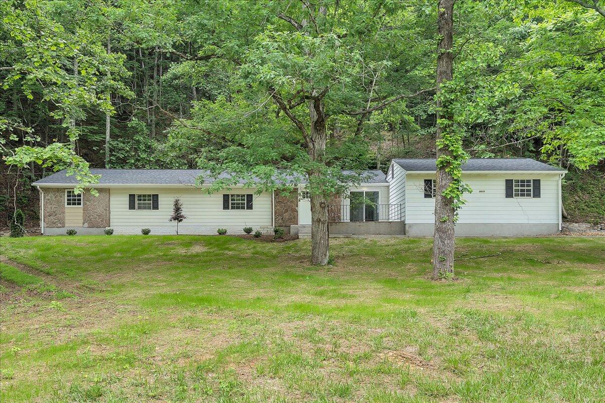 5679 Franklin Road Roanoke, VA 24014 - Photo 1 of 36 a view of a house with a yard and a large tree