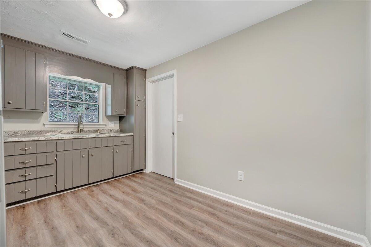 5679 Franklin Road Roanoke, VA 24014 - Photo 11 of 36 a room with a white bed cabinets and a window