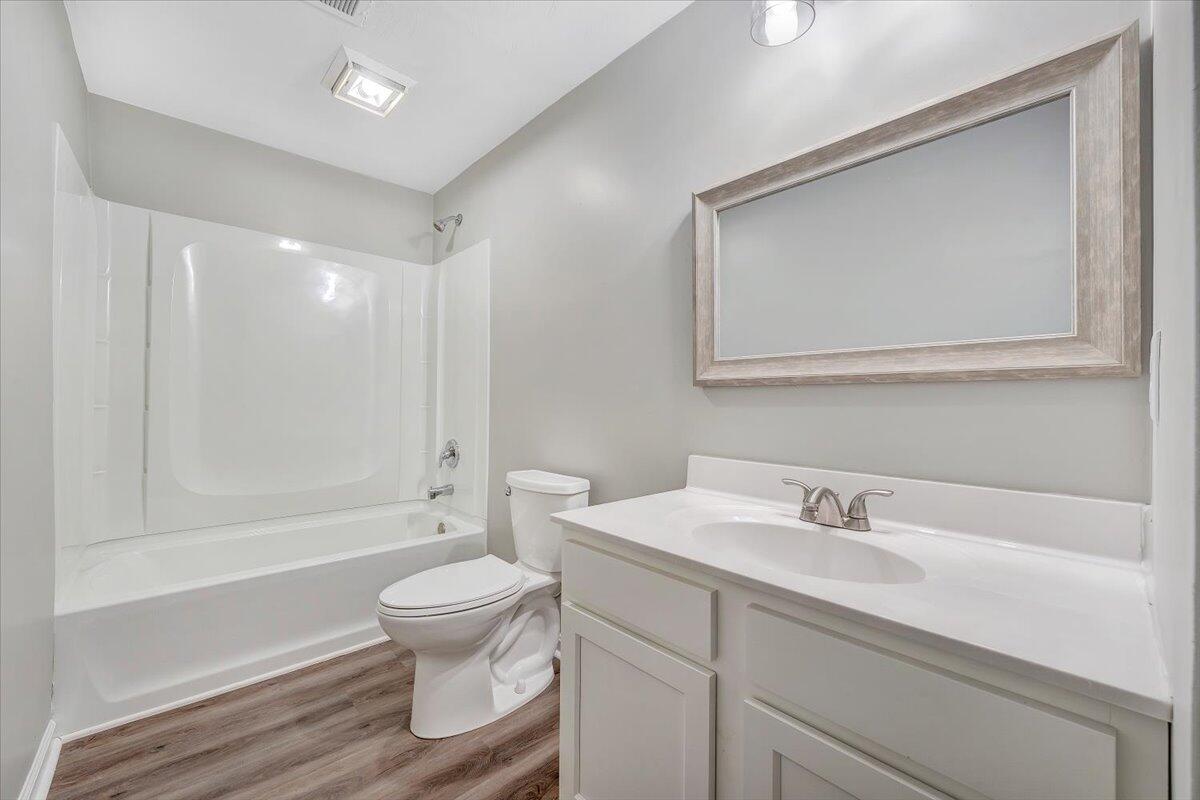 5679 Franklin Road Roanoke, VA 24014 - Photo 15 of 36 a bathroom with a sink a toilet and a large mirror