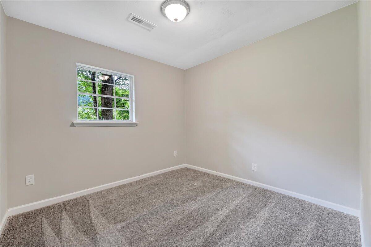 5679 Franklin Road Roanoke, VA 24014 - Photo 22 of 36 an empty room with a window