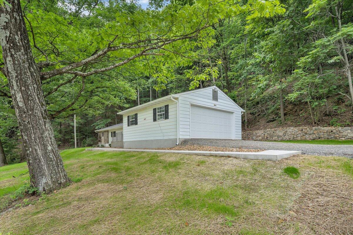 5679 Franklin Road Roanoke, VA 24014 - Photo 33 of 36 a backyard of a house with lots of green space