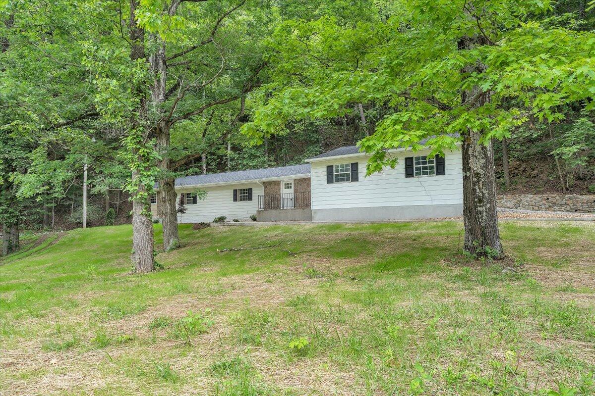 5679 Franklin Road Roanoke, VA 24014 - Photo 34 of 36 a view of a house with a backyard