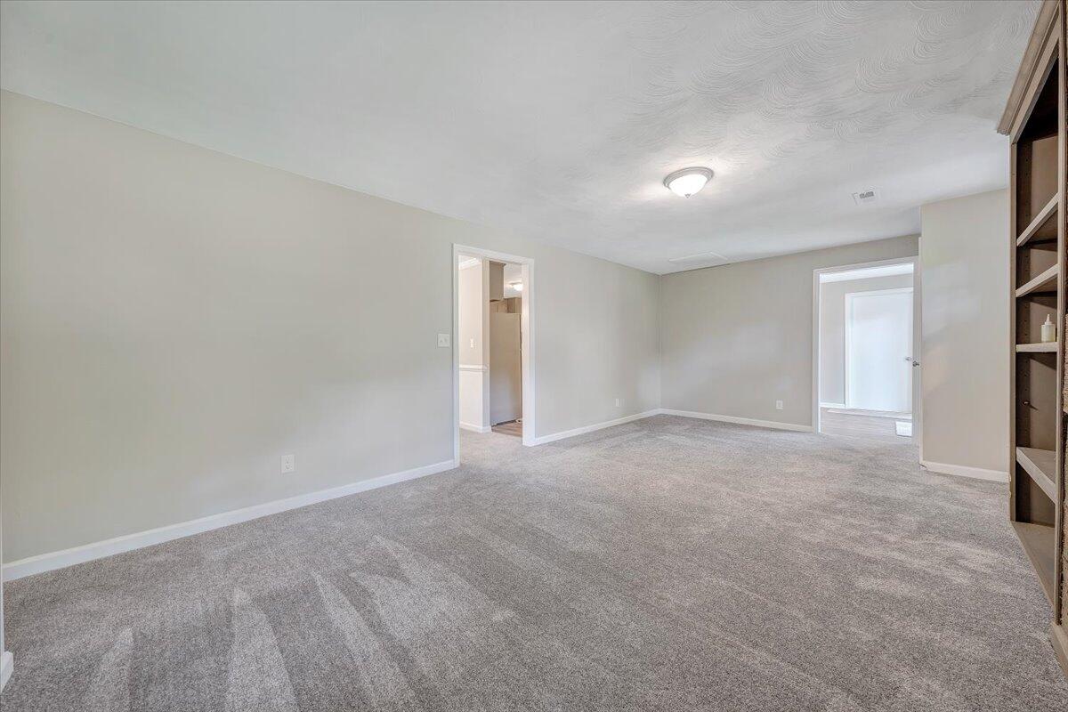 5679 Franklin Road Roanoke, VA 24014 - Photo 4 of 36 a view of an empty room with a window