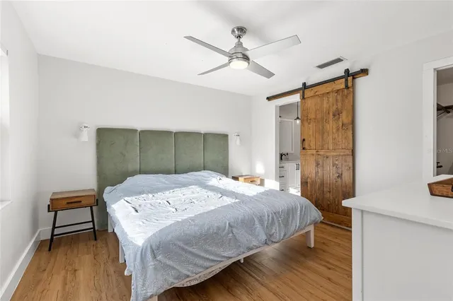 a bedroom with a bed and a table