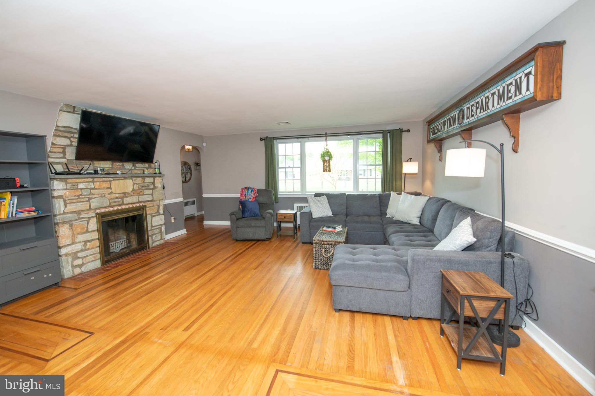 1259 Glenbrook Road Huntingdon Valley, PA 19006 - Photo 21 of 78 a living room with furniture fireplace and flat screen tv