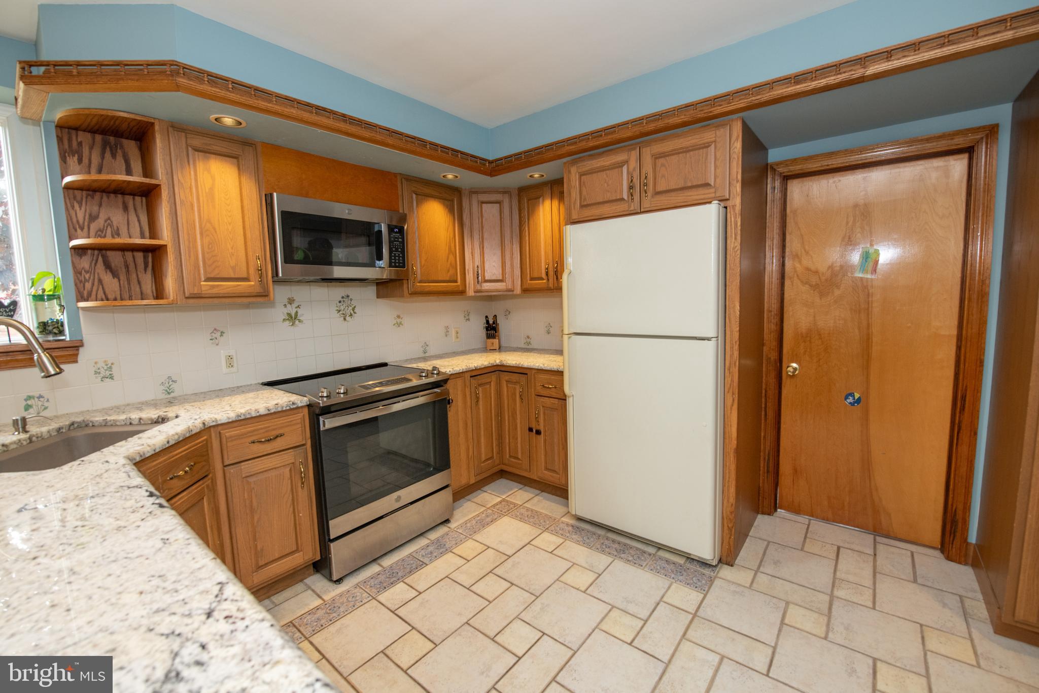 1259 Glenbrook Road Huntingdon Valley, PA 19006 - Photo 32 of 78 a kitchen with stainless steel appliances granite countertop a refrigerator a stove a sink and a microwave