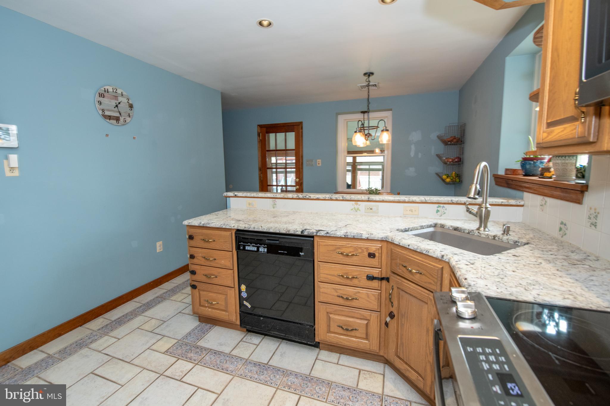 1259 Glenbrook Road Huntingdon Valley, PA 19006 - Photo 33 of 78 a spacious bathroom with a granite countertop sink a mirror and a vanity