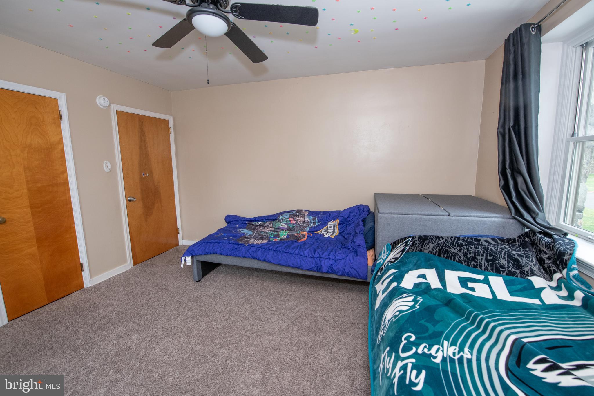 1259 Glenbrook Road Huntingdon Valley, PA 19006 - Photo 47 of 78 a bedroom with a bed and a chandelier