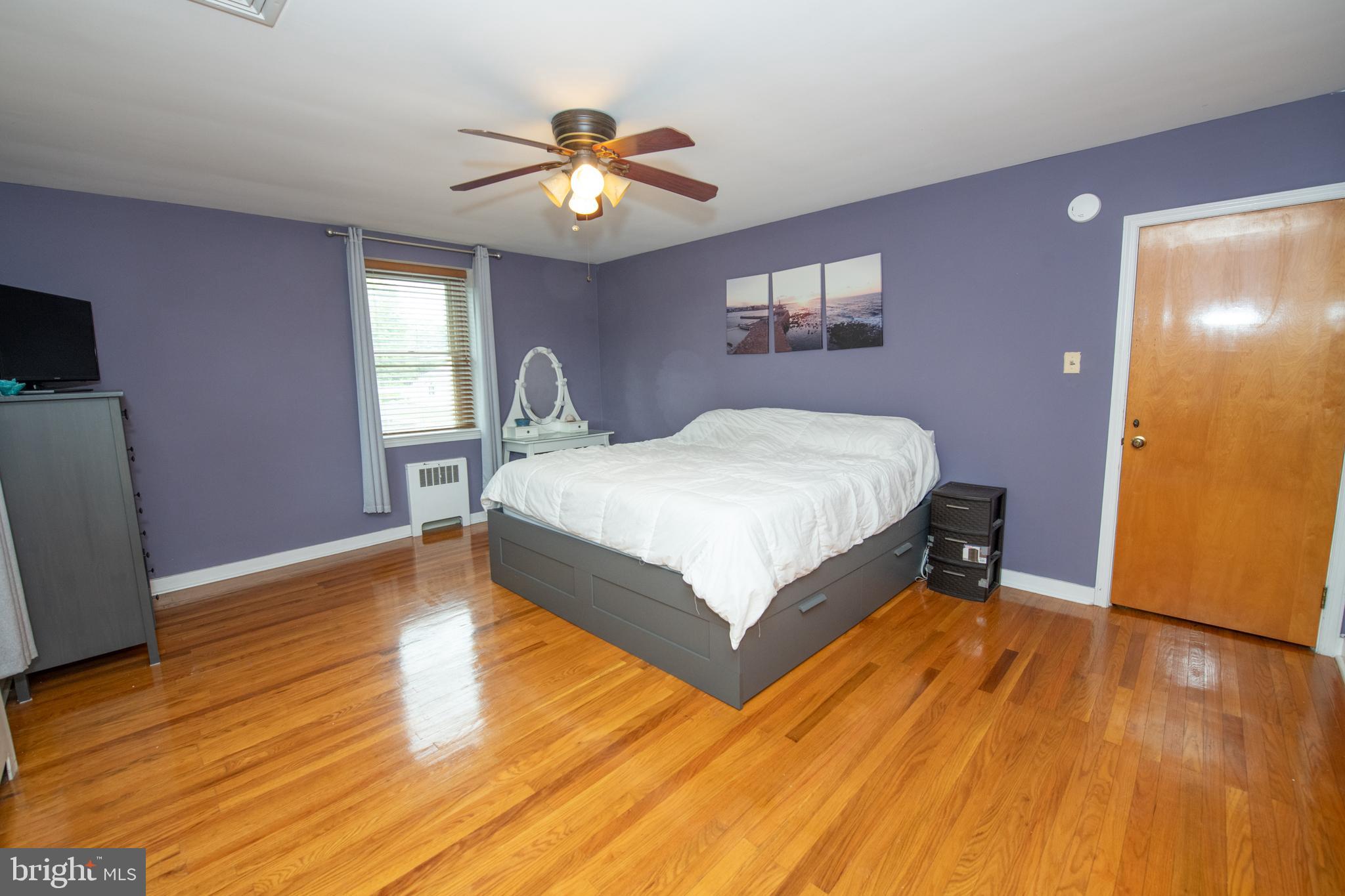 1259 Glenbrook Road Huntingdon Valley, PA 19006 - Photo 49 of 78 a bedroom with a bed and a chandelier