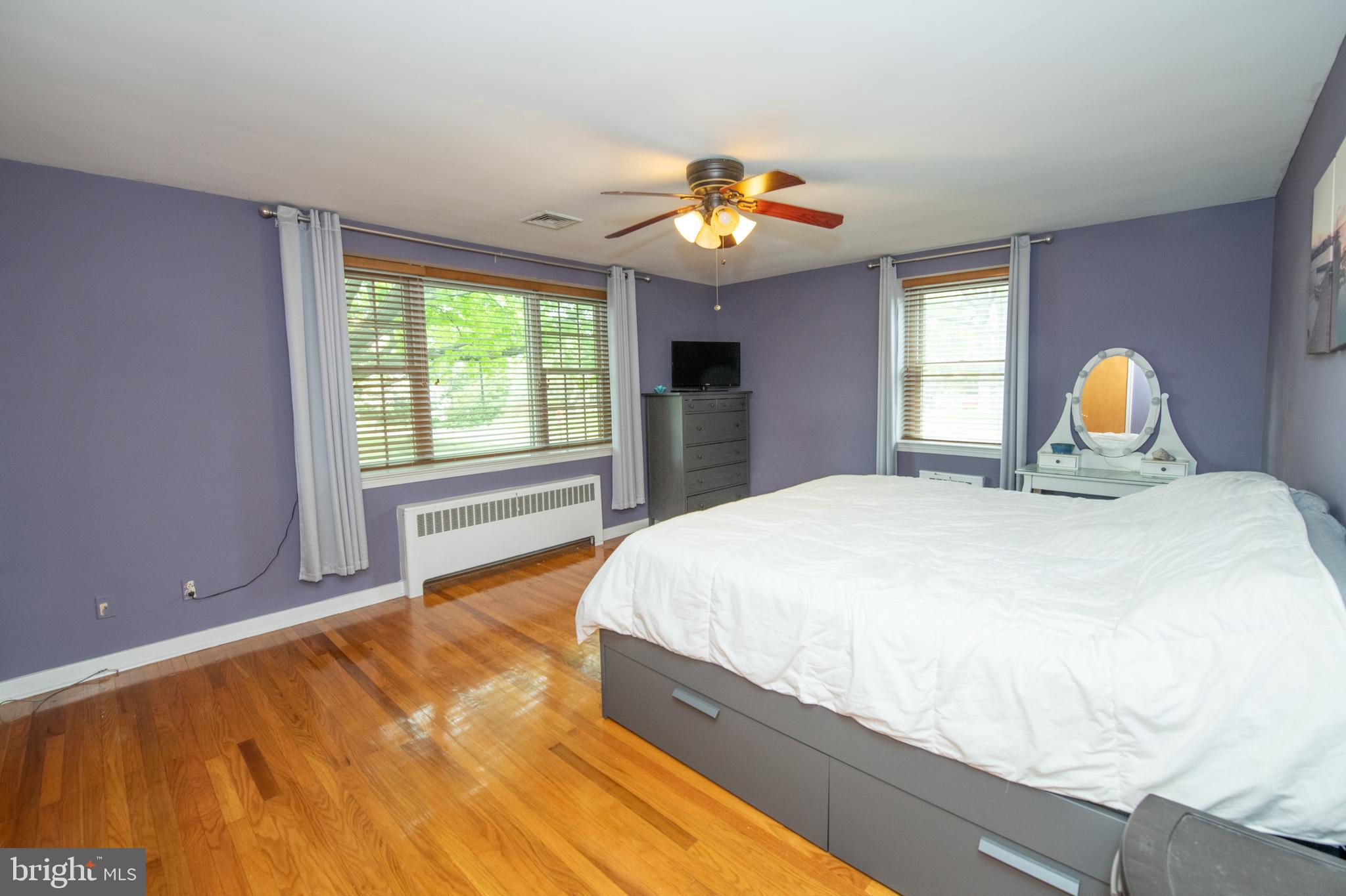 1259 Glenbrook Road Huntingdon Valley, PA 19006 - Photo 51 of 78 a bedroom with a bed and a chandelier