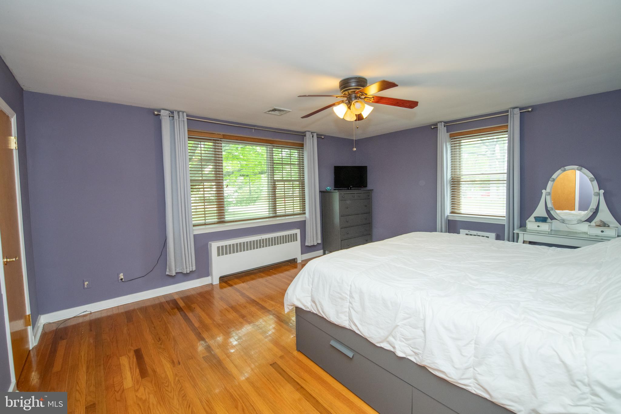 1259 Glenbrook Road Huntingdon Valley, PA 19006 - Photo 53 of 78 a bedroom with a bed and a chandelier