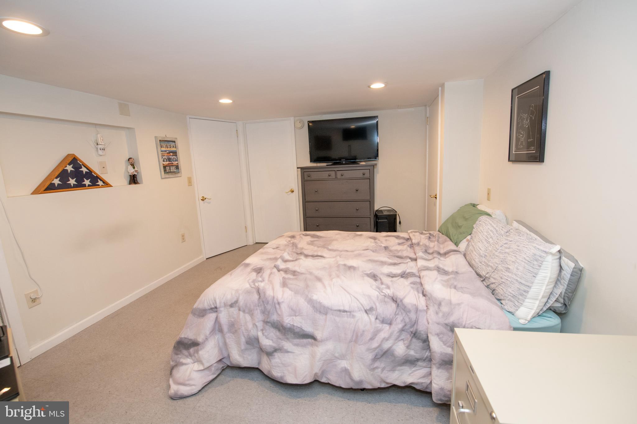 1259 Glenbrook Road Huntingdon Valley, PA 19006 - Photo 71 of 78 a bedroom with a bed and a television