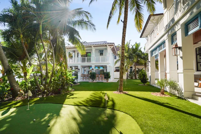a bedroom with a bed and ceiling fan