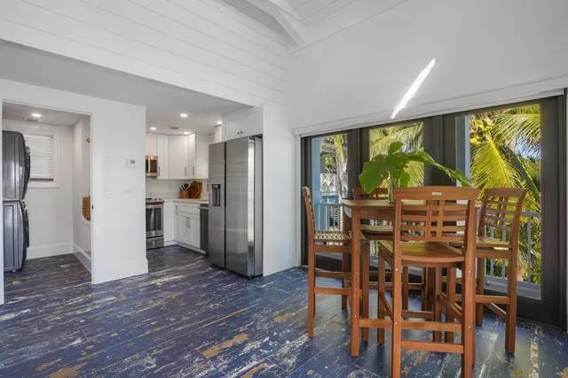 a view of a house with swimming pool and sitting area