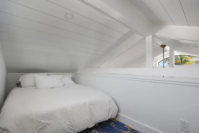 a bathroom with a toilet a sink and shower