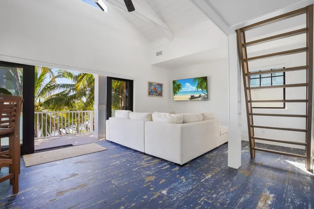 a view of a patio with table and chairs and potted plants