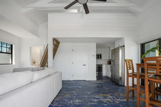 a building outdoor space with patio furniture and potted plants