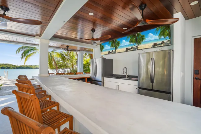 a living room with furniture a air conditioner and a window