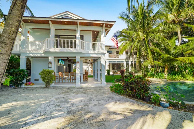 a bedroom with a large bed and a large window