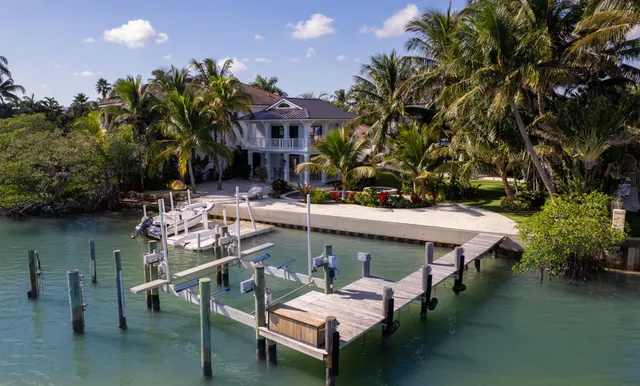 a front view of a multi story residential apartment building with a yard