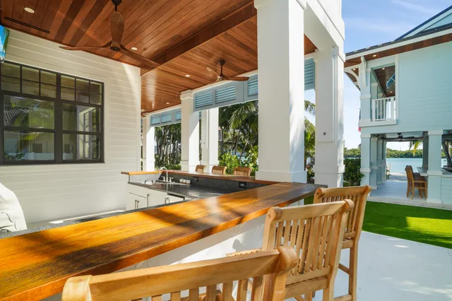 a balcony with furniture and a potted plant