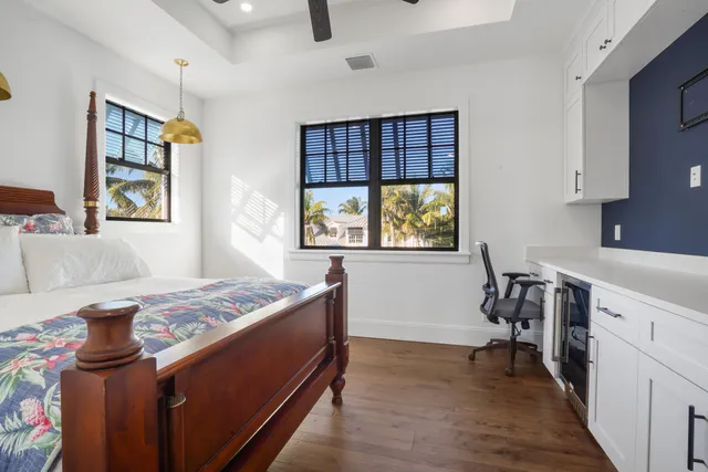 a view of a house with a balcony and wooden floor