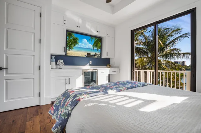 a kitchen with stainless steel appliances kitchen island granite countertop a stove and a refrigerator