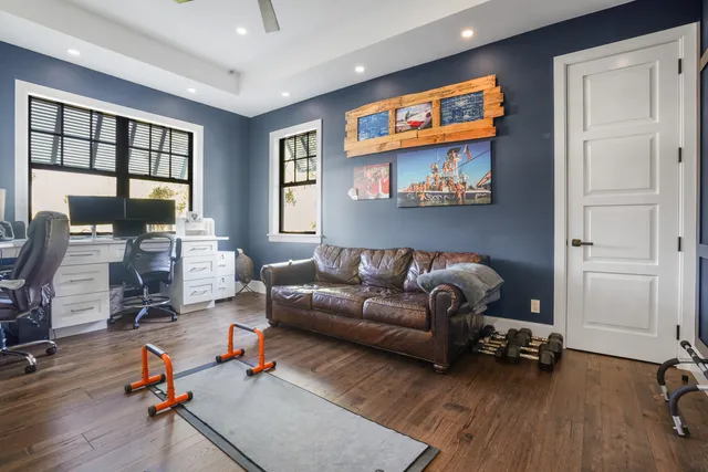 a view of a room with wooden floor