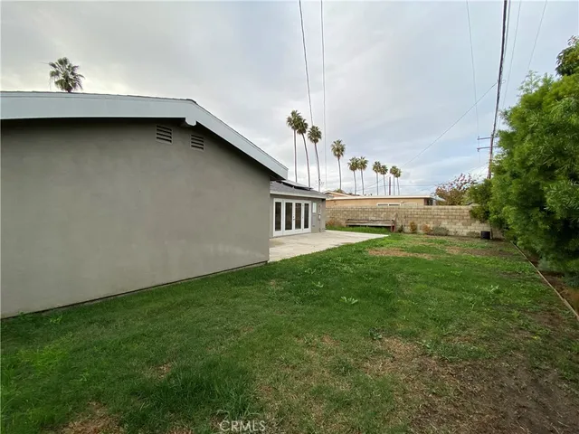a view of a house with a back yard