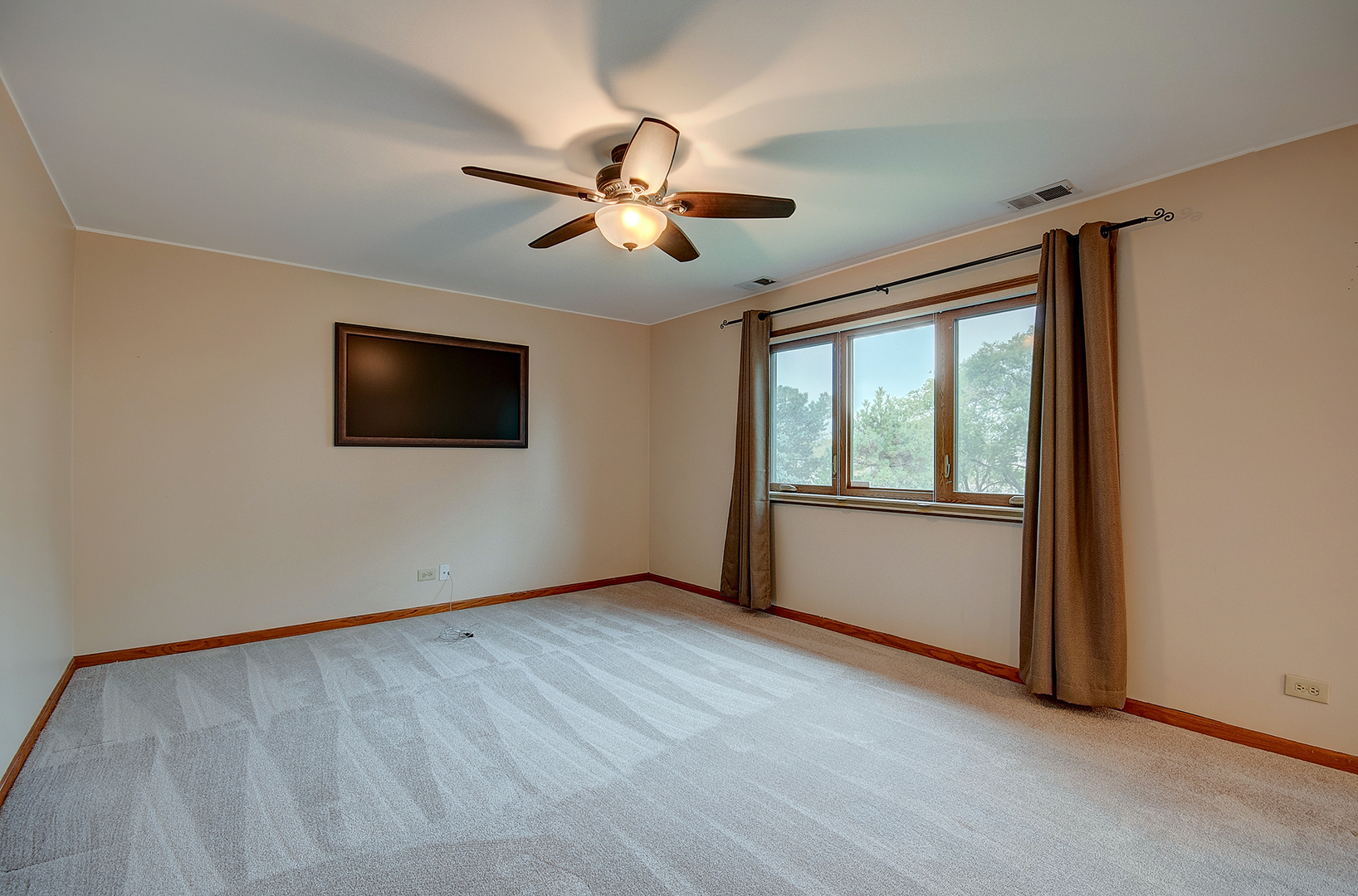 2757 Harbor Drive, Unit 2757 Joliet, IL 60431 - Photo 12 of 26 a view of an empty room with wooden floor and a window