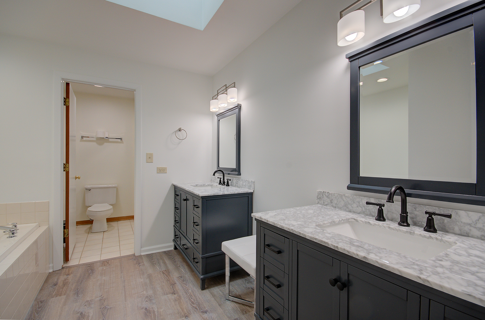 2757 Harbor Drive, Unit 2757 Joliet, IL 60431 - Photo 17 of 26 a spacious bathroom with a granite countertop sink a toilet and a mirror