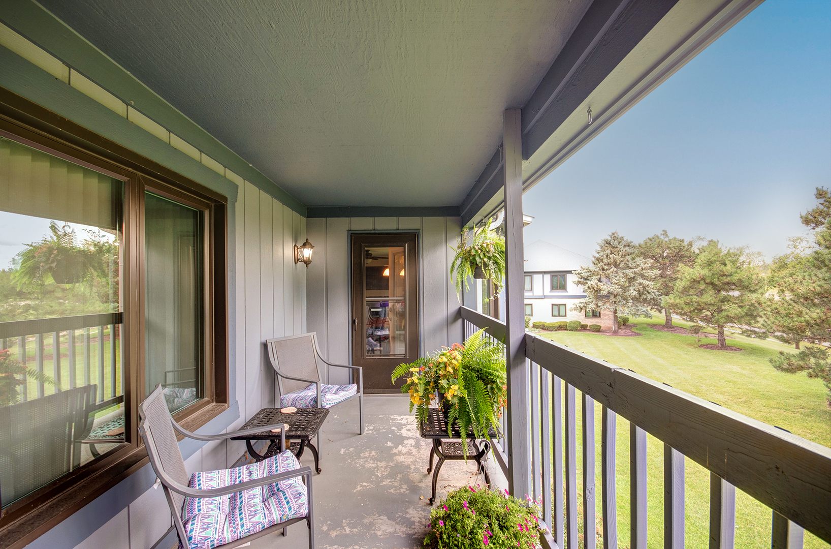 2757 Harbor Drive, Unit 2757 Joliet, IL 60431 - Photo 23 of 26 a balcony with furniture and garden view